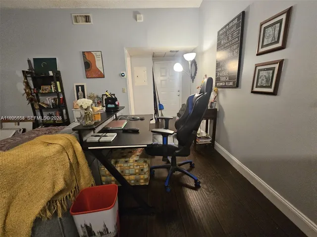 a kitchen with a stove and a refrigerator
