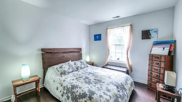 a bedroom with a bed and a tv on table