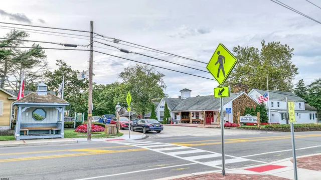 a view of street along with parked cars