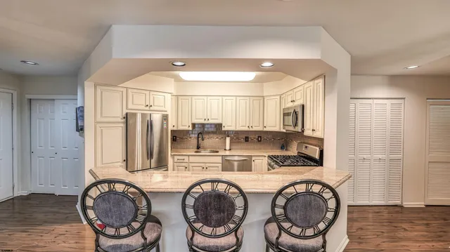 a bathroom with a sink a washer and dryer