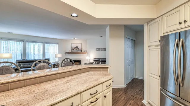 a kitchen with counter top space cabinets and stainless steel appliances