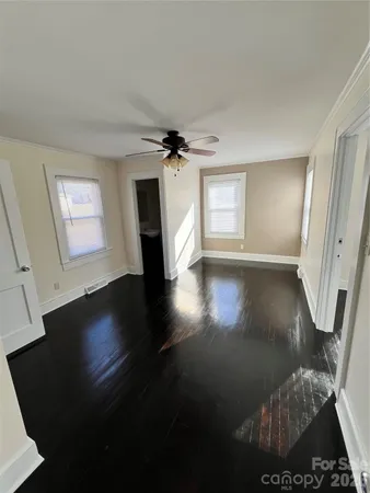 a view of livingroom with hardwood floor and a ceiling fan