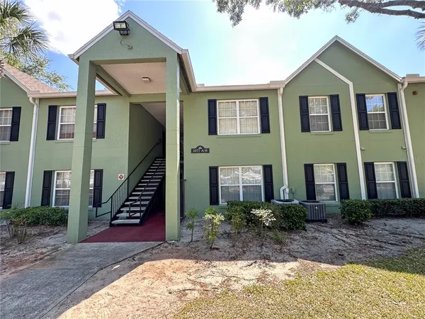 a front view of a house with stairs
