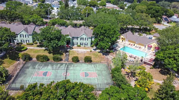 an aerial view of residential houses with outdoor space and street view