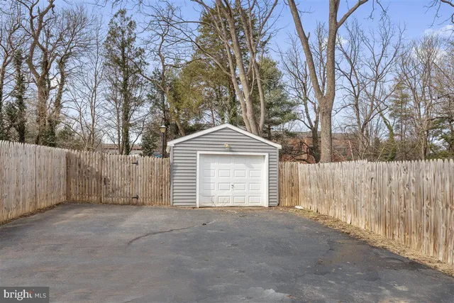 a view of a house with a yard and garage