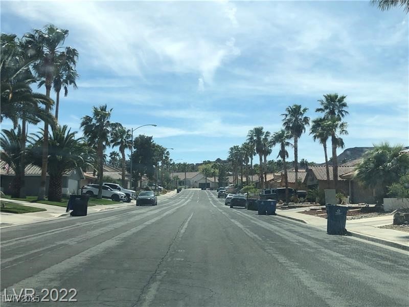 838 Rusty Anchor Way Henderson, NV 89002 - Photo 2 of 18 View of asphalt road featuring sidewalks, street lighting, curbs, and a residential view