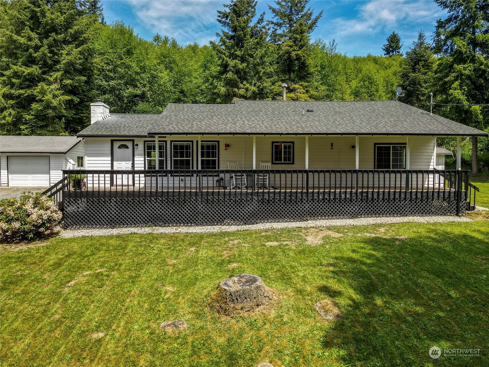 16723 Scott Turner Road East Eatonville, WA 98328 - Photo 1 of 1 a front view of a house with a garden