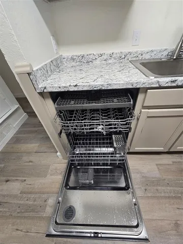 a stove top oven sitting inside of a kitchen