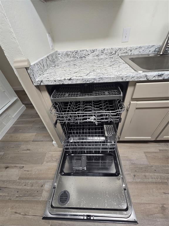 1012 Lynn Street, Unit A Weatherford, TX 76086 - Photo 10 of 15 a stove top oven sitting inside of a kitchen