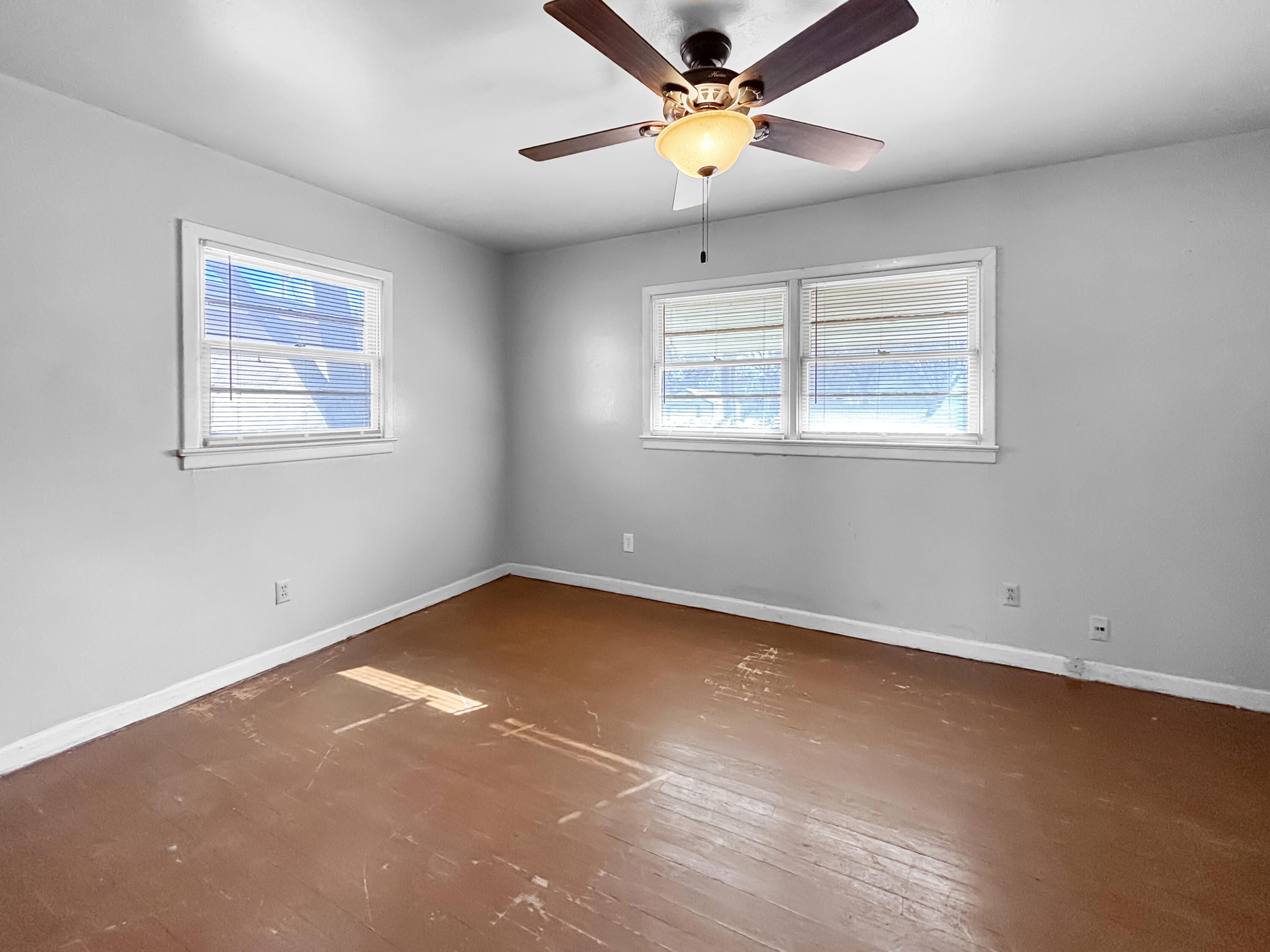 4411 45th Street Lubbock, TX 79414 - Photo 30 of 44 an empty room with a window and a fan