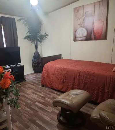 a bedroom with a bed and dresser