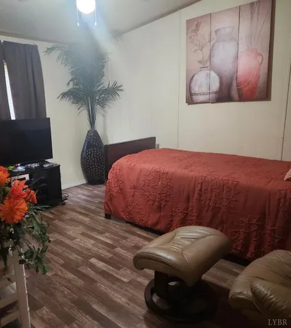 a bedroom with a bed and dresser