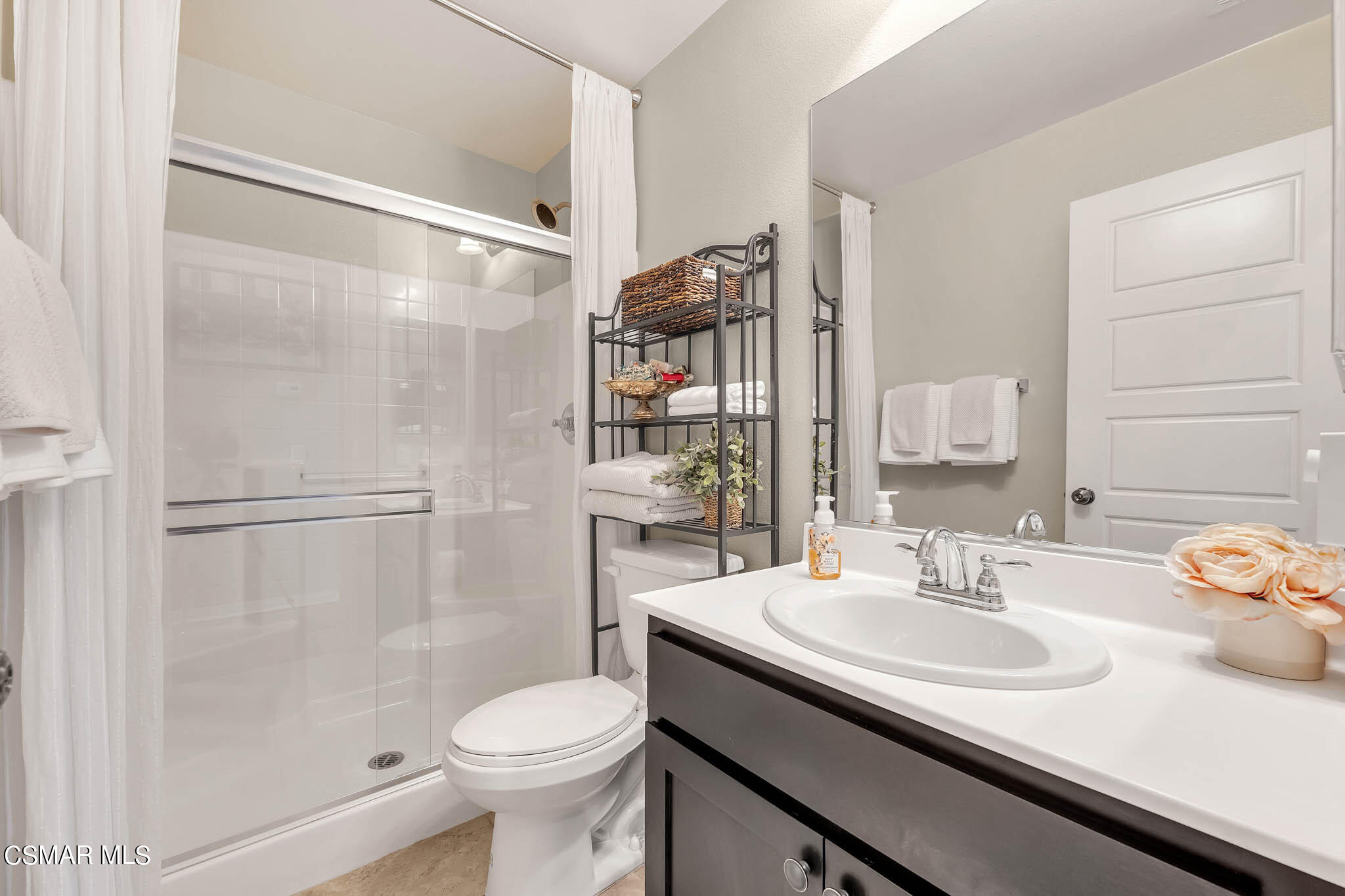 324 River Street Fillmore, CA 93015 - Photo 11 of 48 a bathroom with a sink toilet and shower