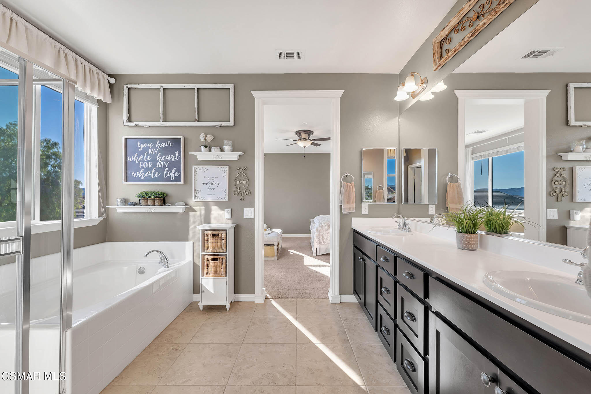 324 River Street Fillmore, CA 93015 - Photo 16 of 48 a large en suite bathroom with a granite countertop tub double vanity sink and a large mirror