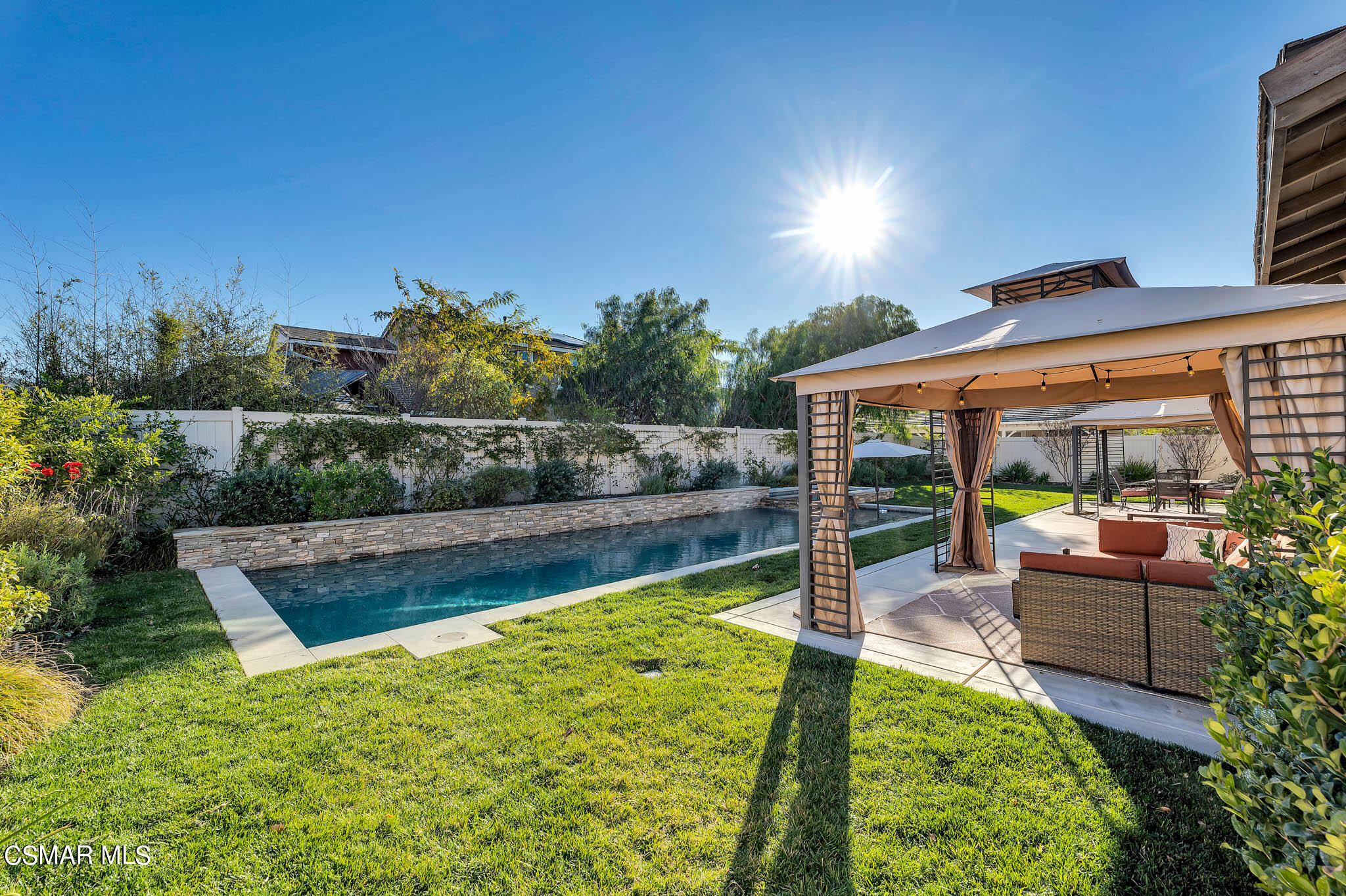 324 River Street Fillmore, CA 93015 - Photo 35 of 48 a view of a swimming pool with a patio and a garden