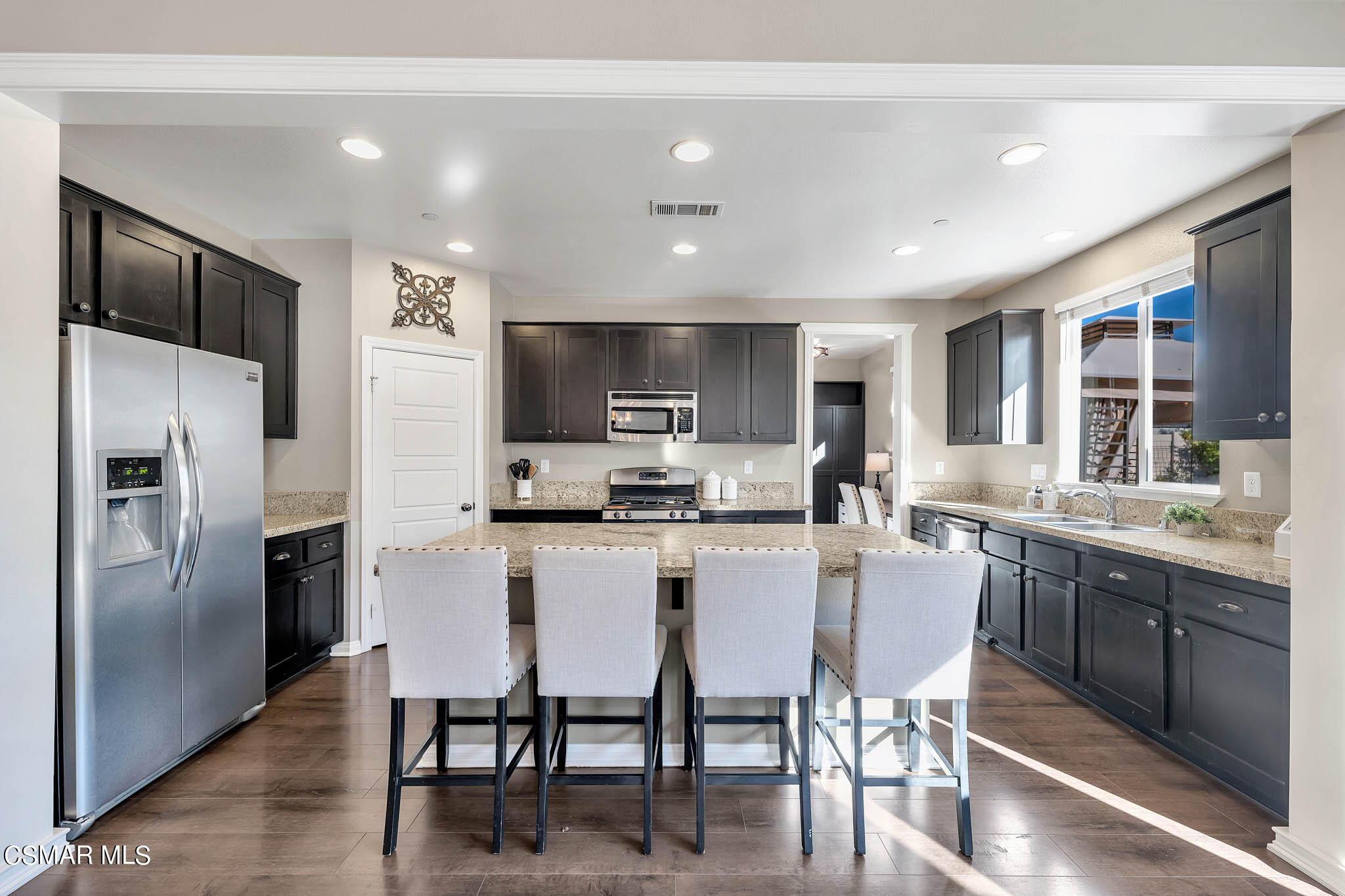 324 River Street Fillmore, CA 93015 - Photo 5 of 48 a kitchen with kitchen island granite countertop a center island stainless steel appliances cabinets and a center island