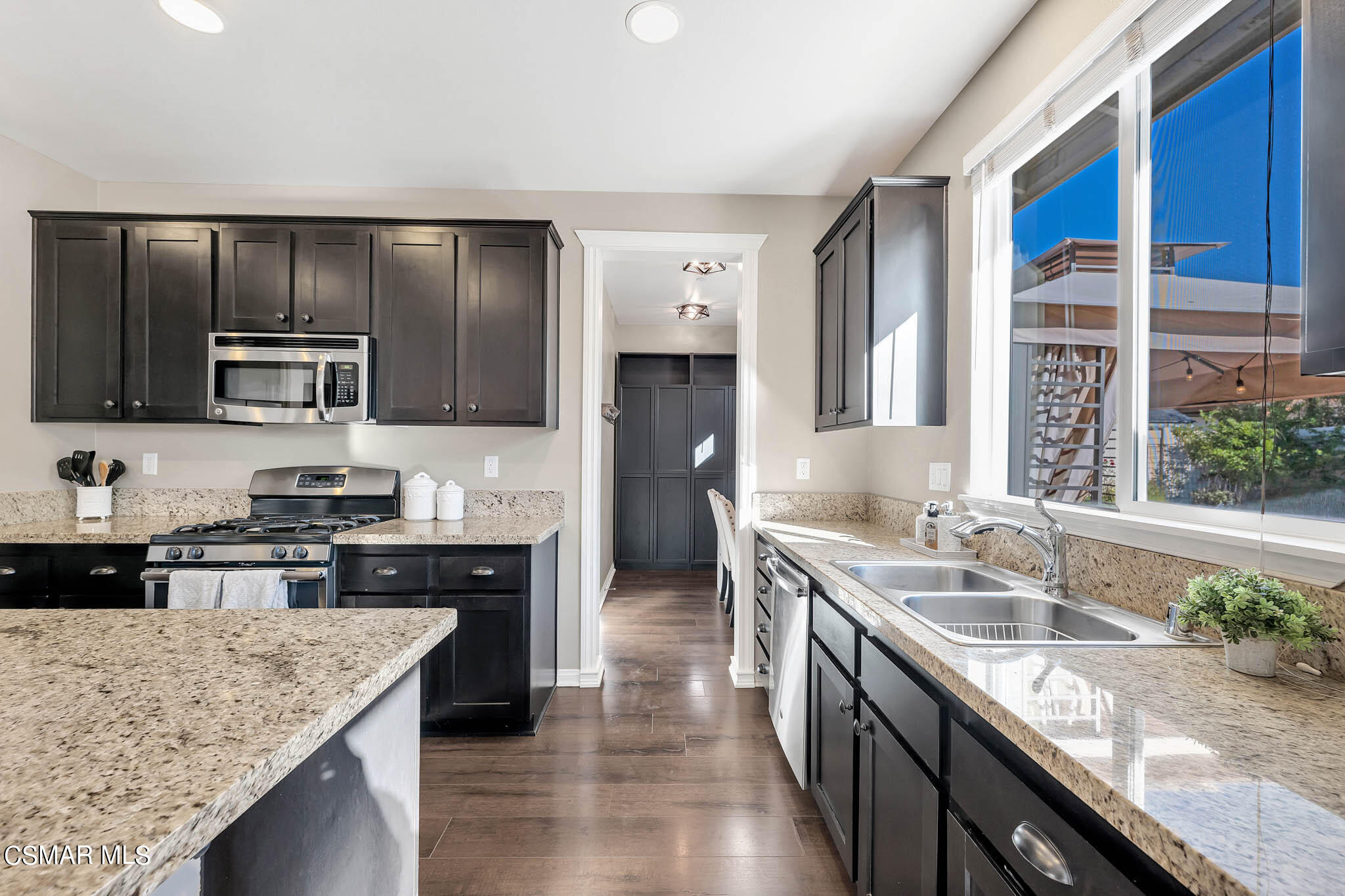 324 River Street Fillmore, CA 93015 - Photo 6 of 48 a kitchen with stainless steel appliances granite countertop a sink stove and refrigerator
