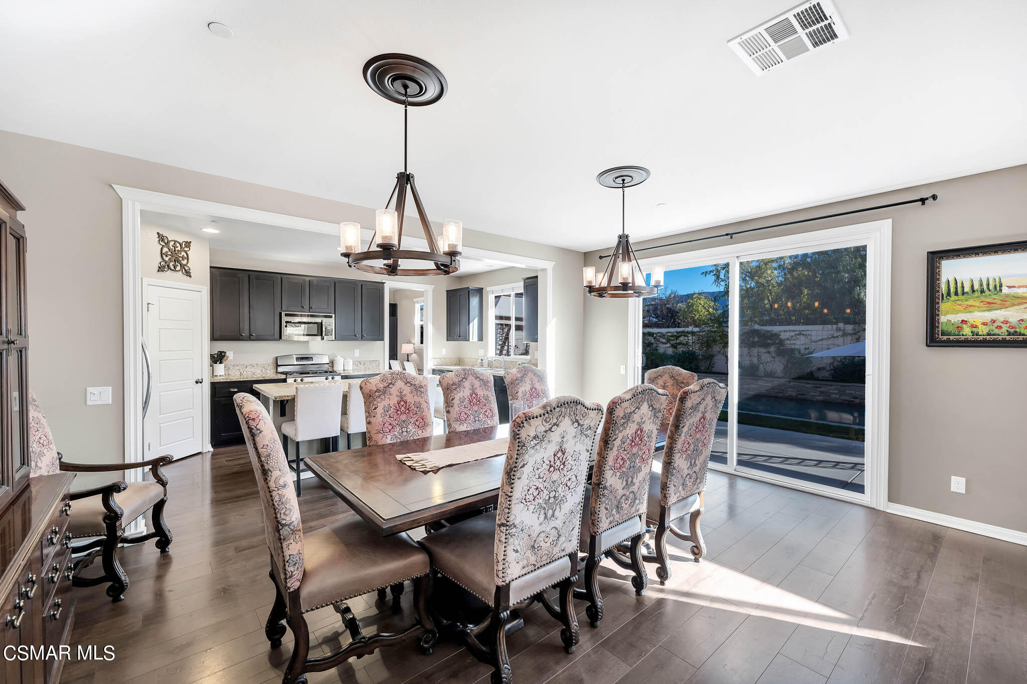 324 River Street Fillmore, CA 93015 - Photo 8 of 48 a dining room with furniture a chandelier and wooden floor
