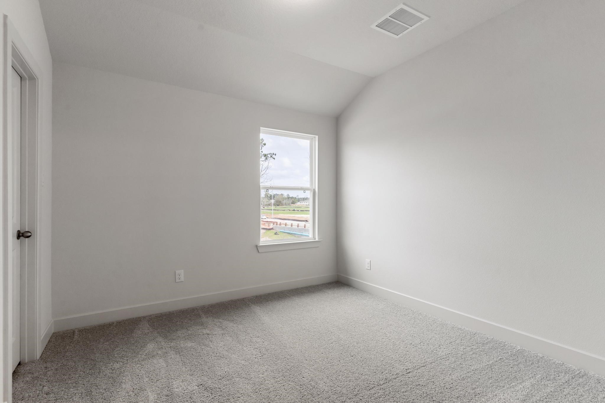 407 Mathis Lk Court Conroe, TX 77304 - Photo 17 of 26 Upstairs Bedroom #3