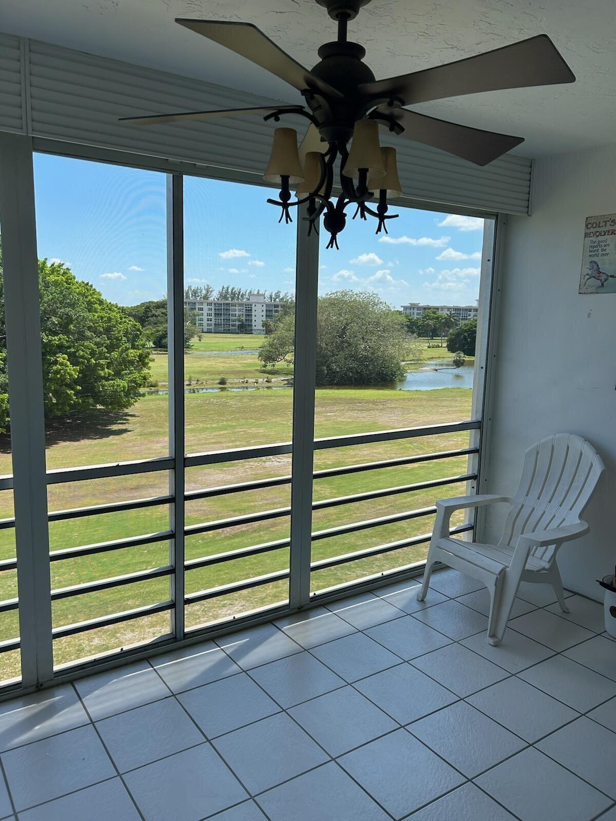 2691 South Course Drive, Unit 408 Pompano Beach, FL 33069 - Photo 2 of 24 a view of a two chairs in the room