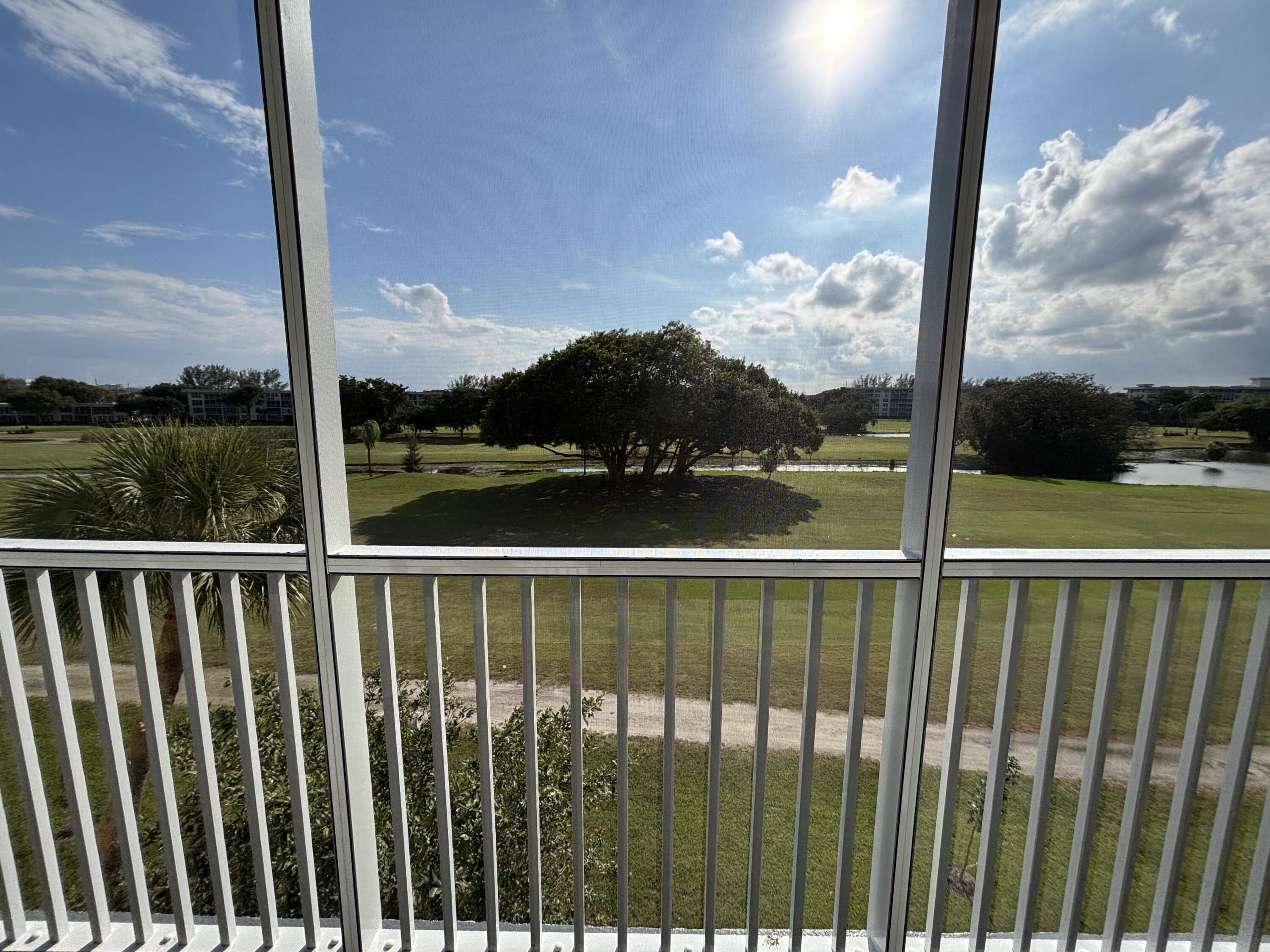 2691 South Course Drive, Unit 408 Pompano Beach, FL 33069 - Photo 21 of 24 a view of a street with a balcony