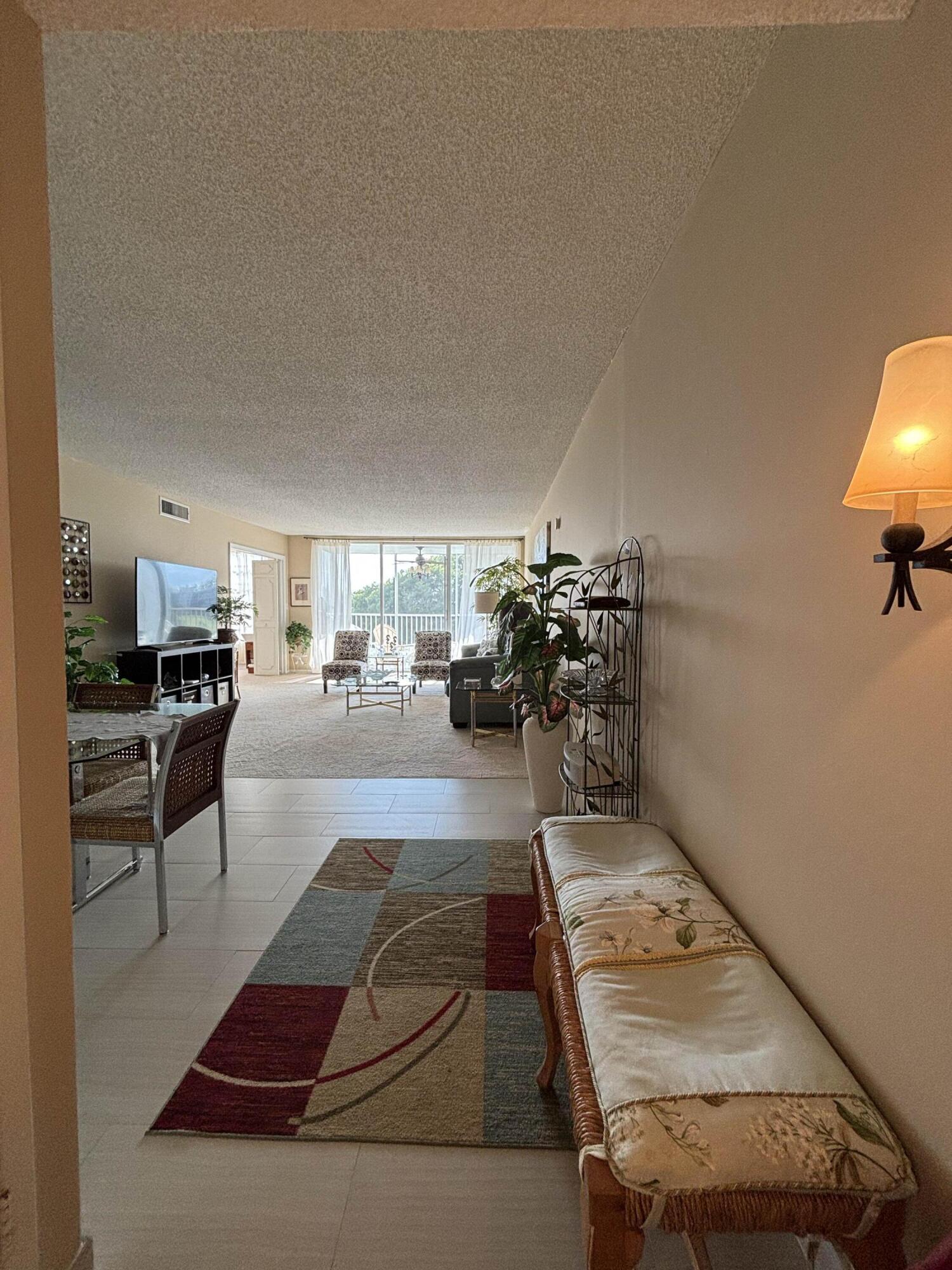 2691 South Course Drive, Unit 408 Pompano Beach, FL 33069 - Photo 9 of 24 a living room with furniture