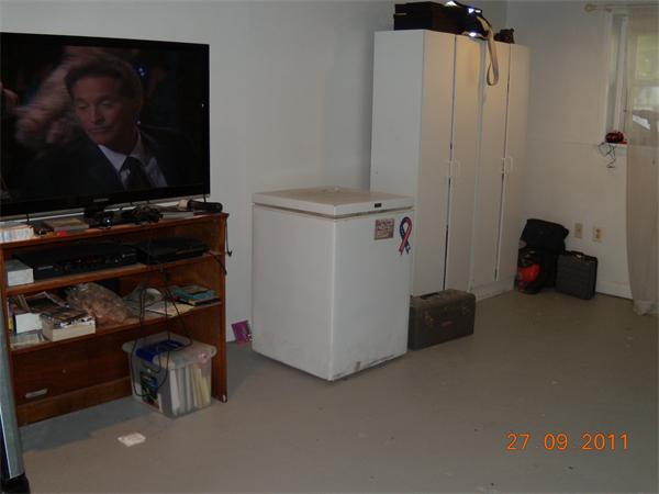 49 Leighton Road Boston, MA 02136 - Photo 3 of 12 a room with water heater and a cabinet