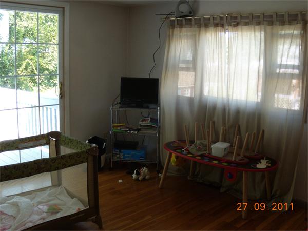 49 Leighton Road Boston, MA 02136 - Photo 4 of 12 a living room with furniture and a flat screen tv