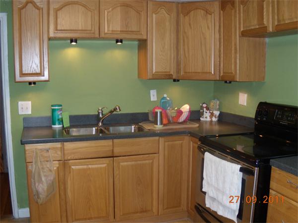 49 Leighton Road Boston, MA 02136 - Photo 6 of 12 a kitchen with stainless steel appliances granite countertop a sink stove and cabinets