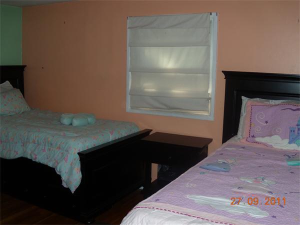 49 Leighton Road Boston, MA 02136 - Photo 10 of 12 a bedroom with a bed and a window