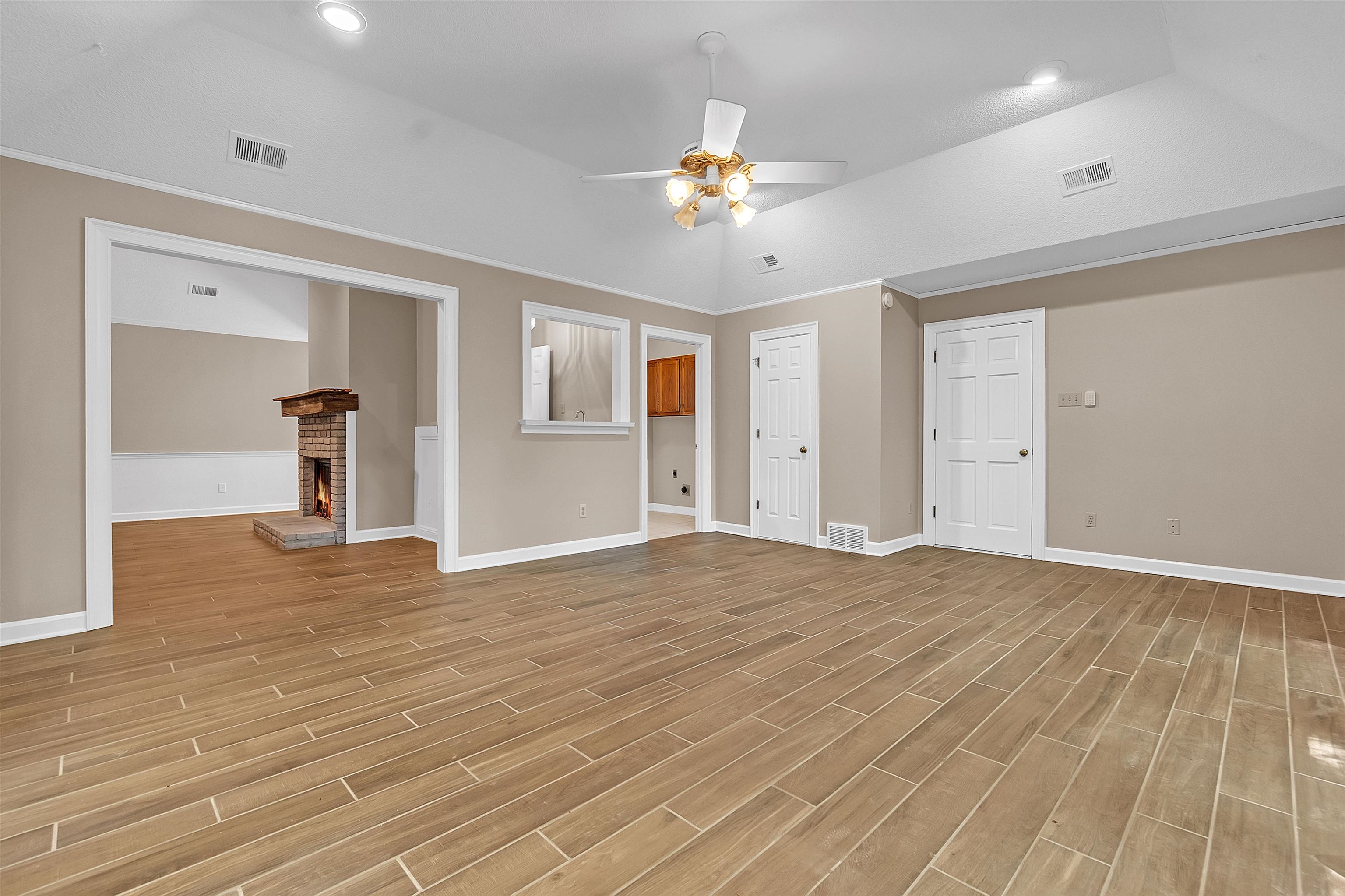 400 Reksten Cove Memphis, TN 38018 - Photo 13 of 26 Spacious common area featuring wood-finish flooring, vaulted ceiling, and recessed lighting