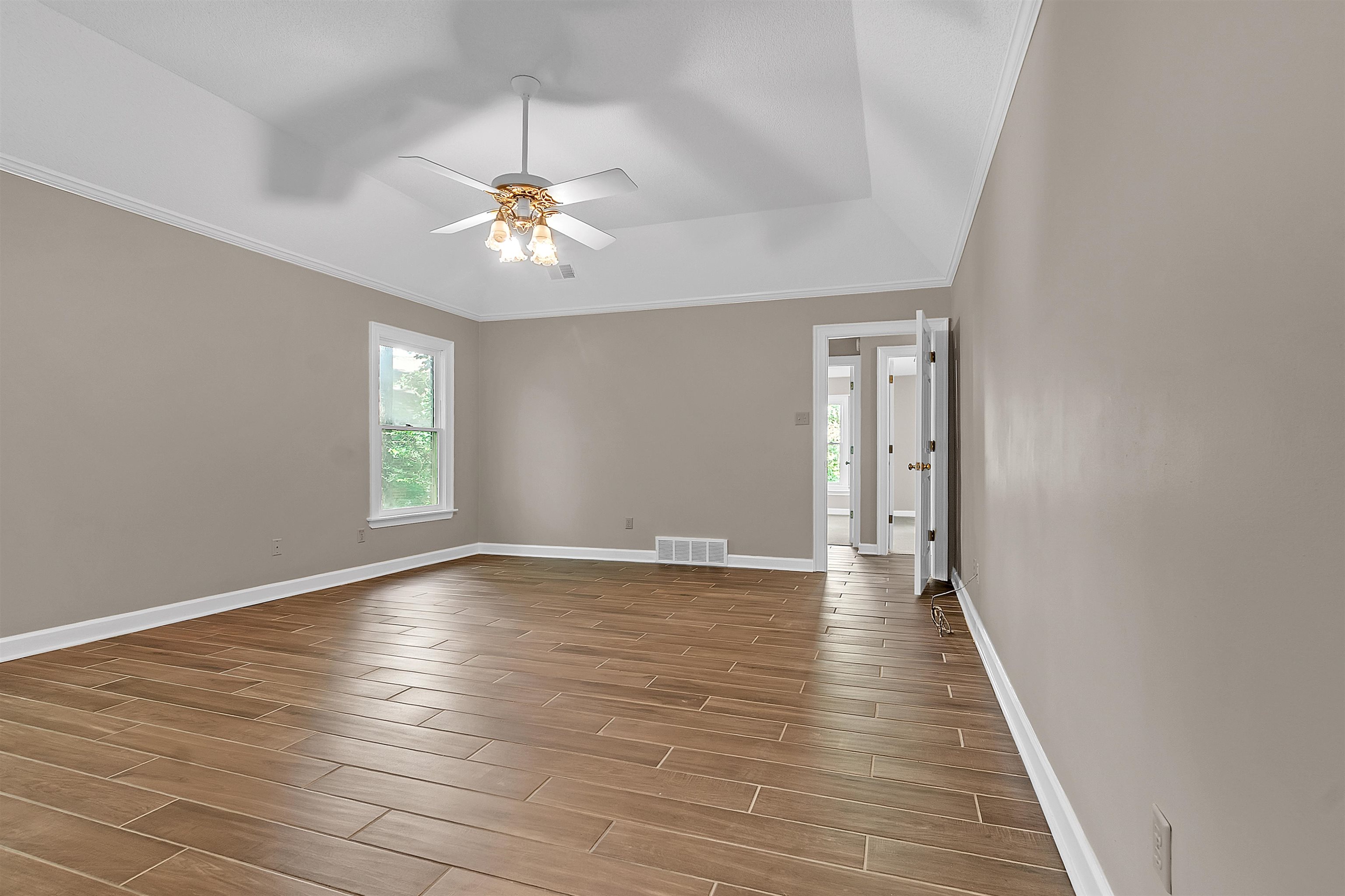 400 Reksten Cove Memphis, TN 38018 - Photo 16 of 26 Spacious room featuring wood-finish flooring, neutral-toned walls, and a recessed ceiling