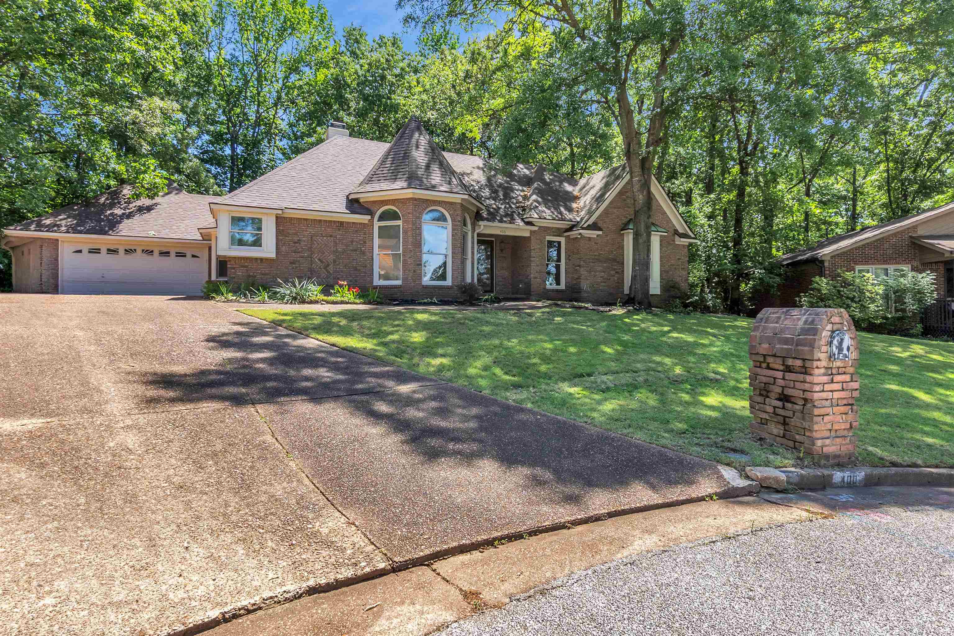 400 Reksten Cove Memphis, TN 38018 - Photo 2 of 26 Brick exterior with a conical turret and arched windows
