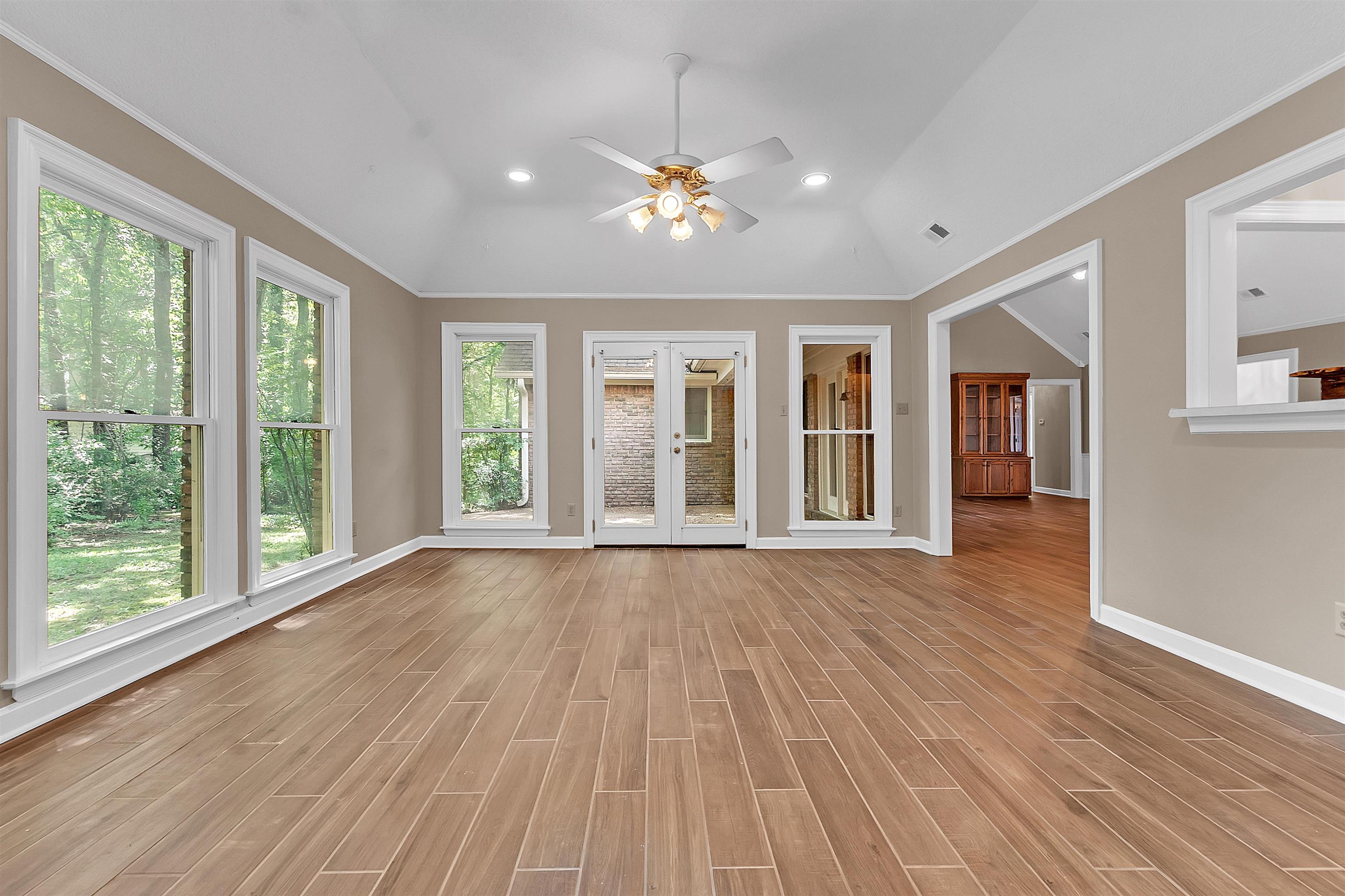 400 Reksten Cove Memphis, TN 38018 - Photo 7 of 26 Spacious room featuring wood-finish plank flooring, a vaulted ceiling, and recessed lighting