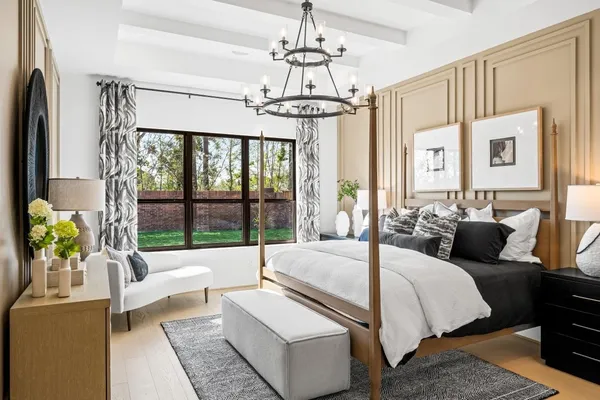 a living room with couch and a chandelier