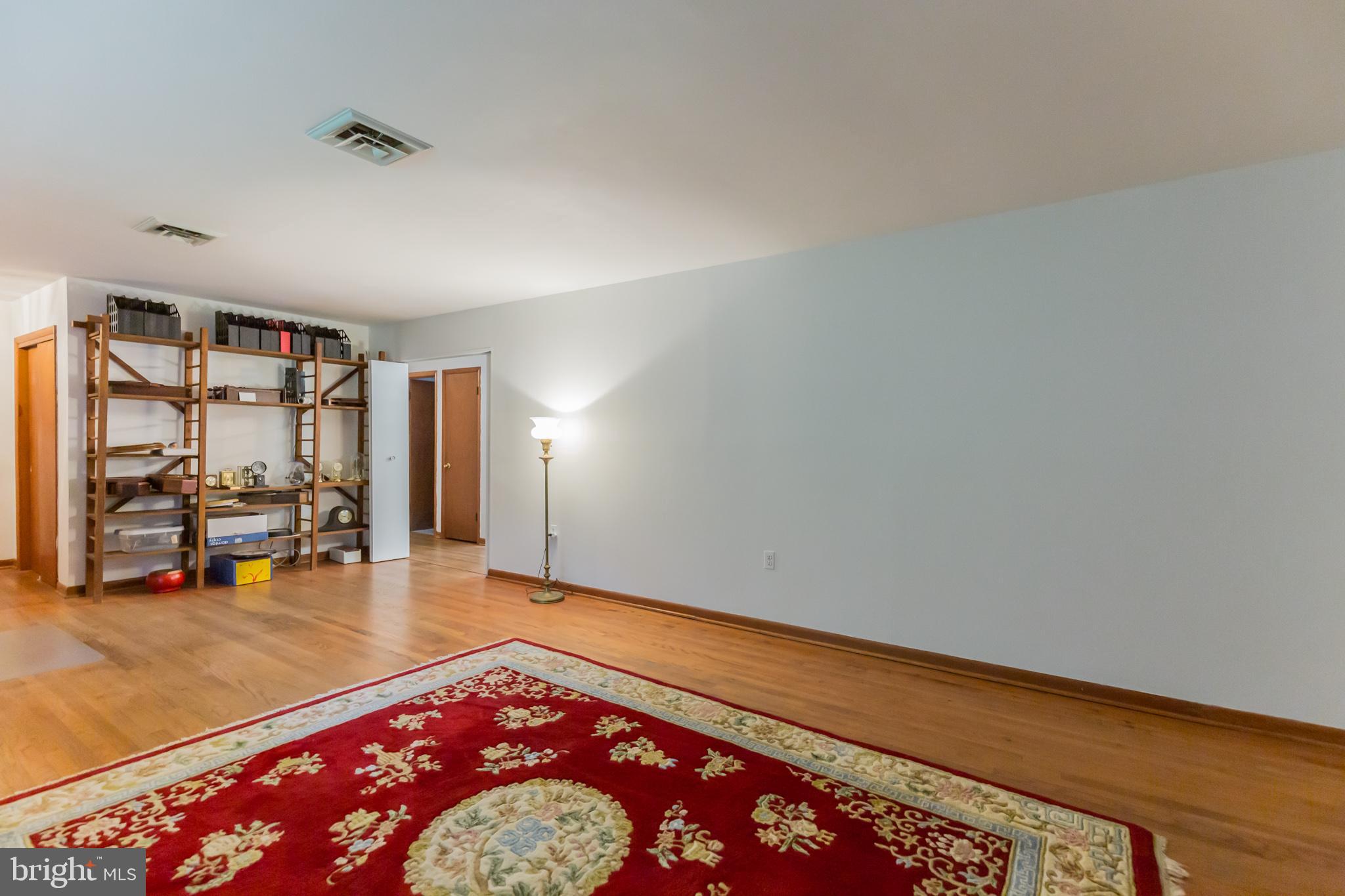 13620 Dowell Road Solomons, MD 20629 - Photo 14 of 28 Large living room with more amazing HW floors.