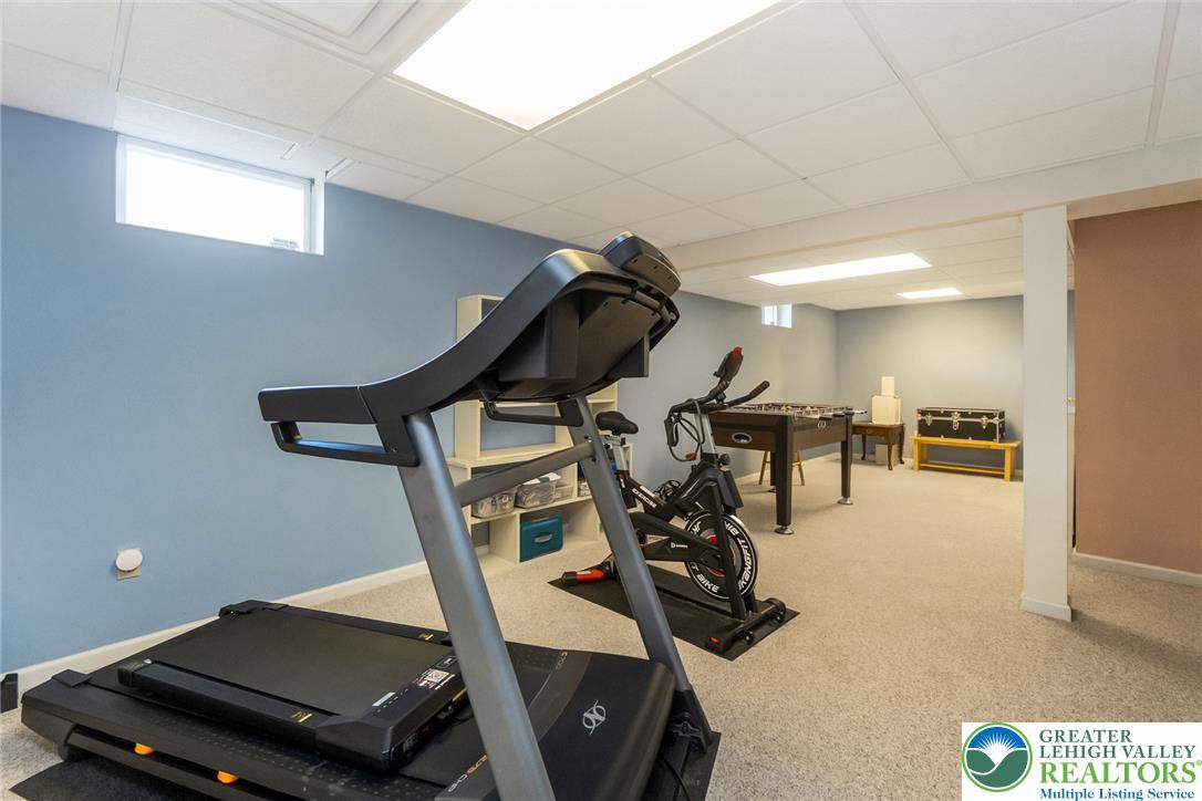 1795 Freier Road Quakertown, PA 18951 - Photo 38 of 69 An inviting basement space, perfect for recreation and fitness, features light-toned carpeting and ample overhead lighting.