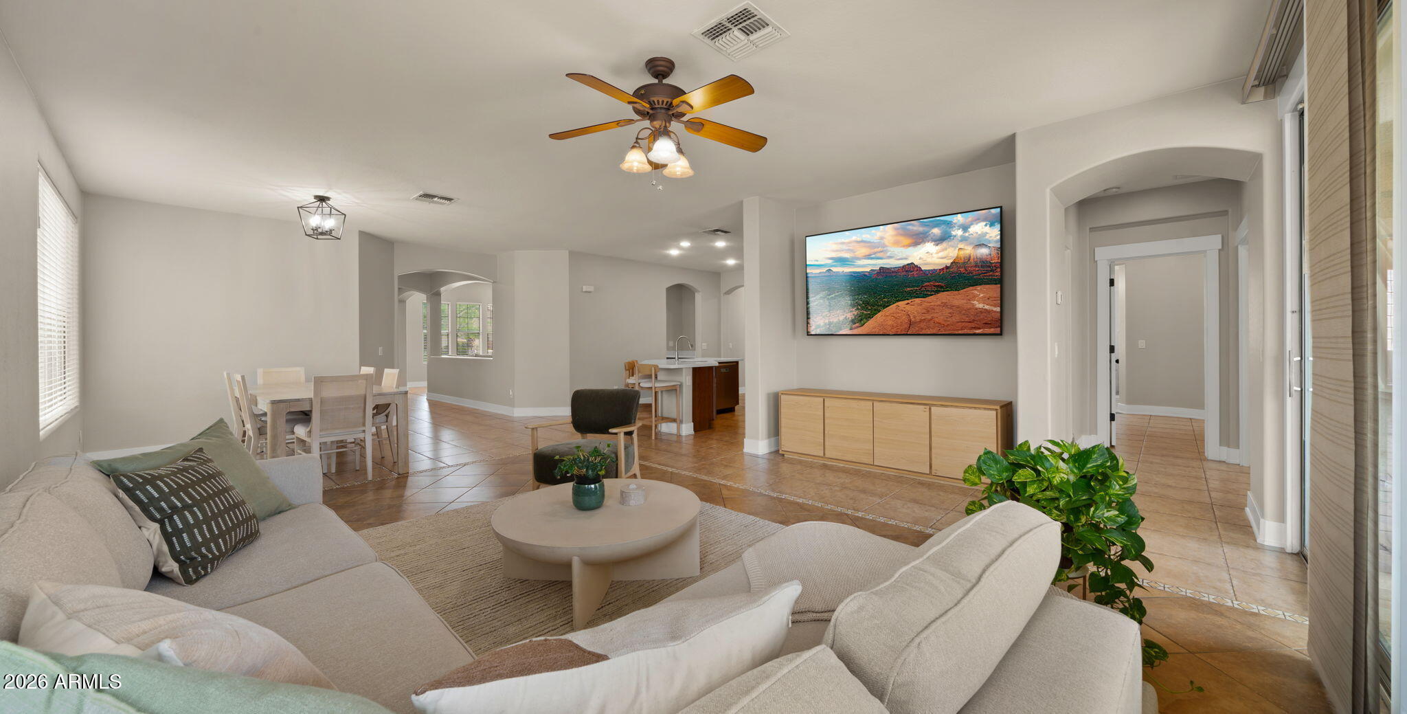 3344 East Hopkins Road Gilbert, AZ 85295 - Photo 32 of 32 a living room with furniture and a large mirror with wooden floor