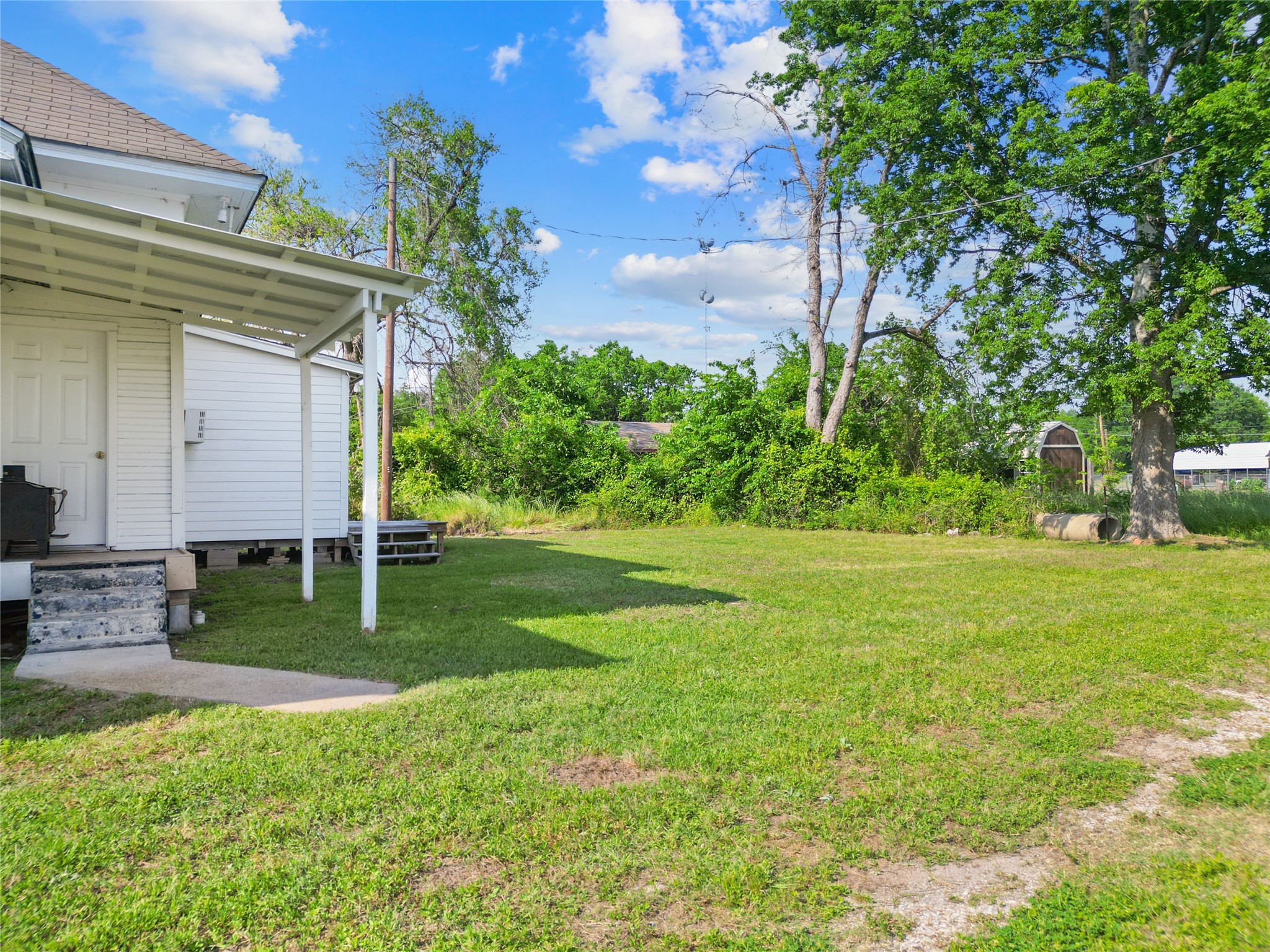 327 South Robb Street Trinity, TX 75862 - Photo 17 of 20 a view of a back yard of the house