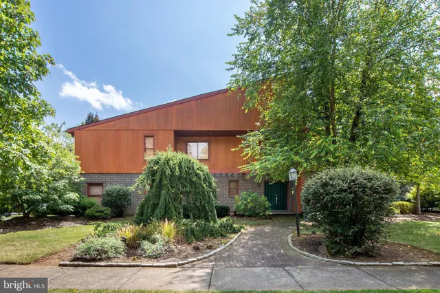 front view of a house with a small yard
