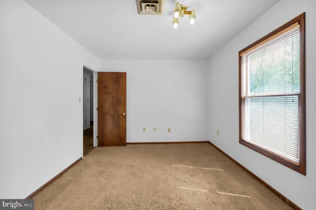a view of a room with wooden walls
