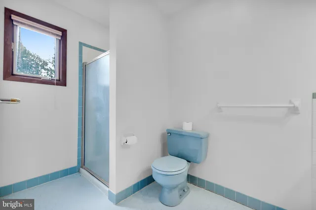 a view of a house with yard and tree s