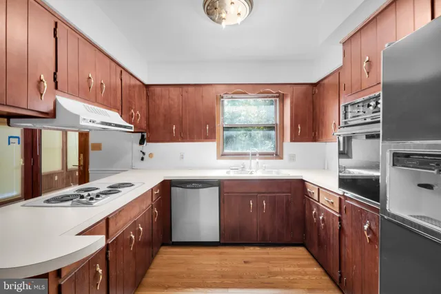 a view of an empty room with glass door