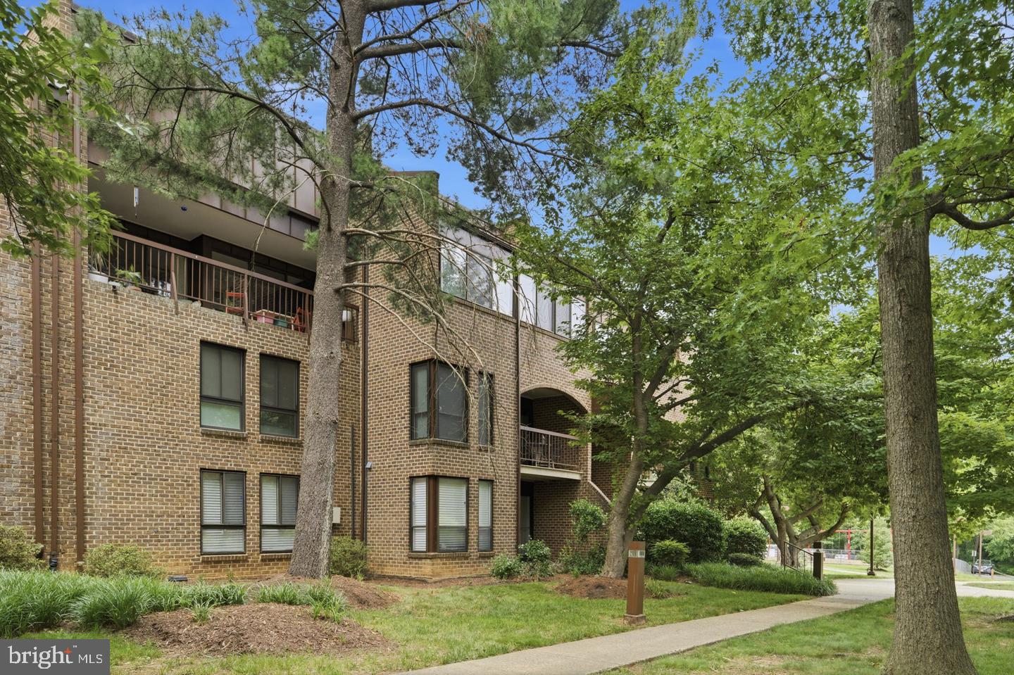 Charming brick apartment amidst greenery.
