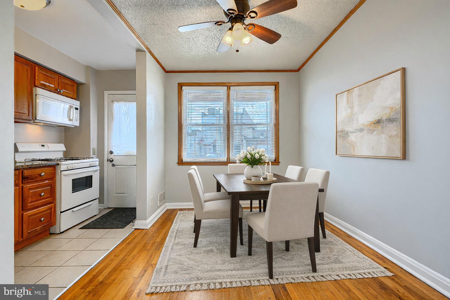 6905 Bank Street Baltimore, MD 21224 - Photo 4 of 17 a view of a dining room with furniture window and wooden floor