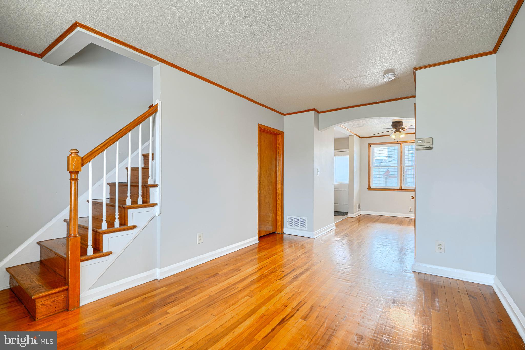 6905 Bank Street Baltimore, MD 21224 - Photo 5 of 17 a view of an entryway with wooden floor and door