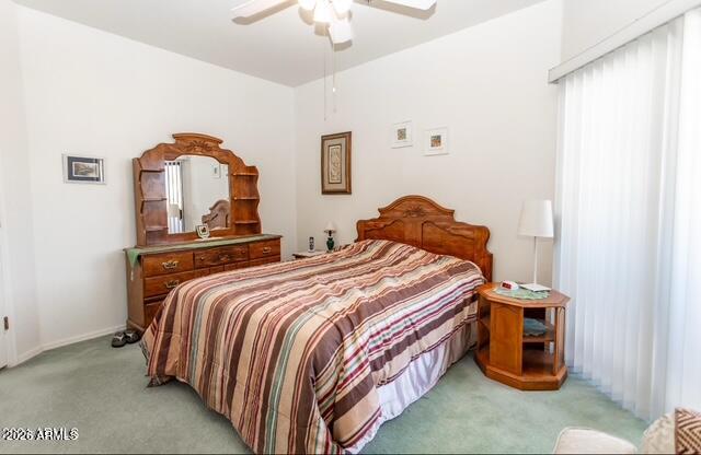 9151 West Greenway Road, Unit 239 Peoria, AZ 85381 - Photo 11 of 18 a bedroom with a bed and a chandelier