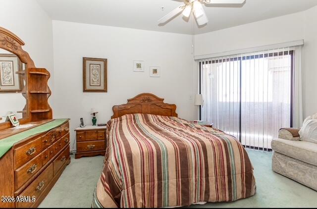 9151 West Greenway Road, Unit 239 Peoria, AZ 85381 - Photo 12 of 18 a bedroom with a bed and a chandelier