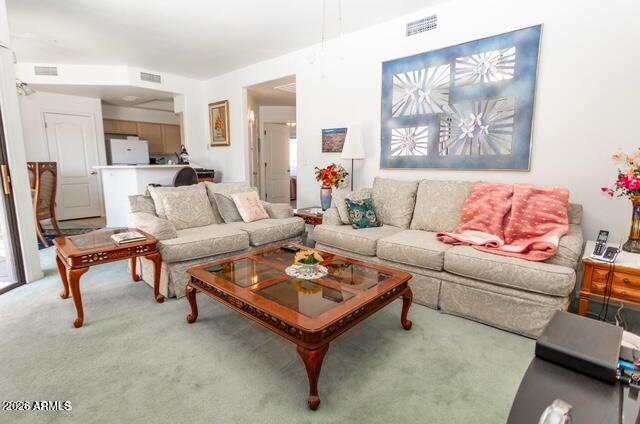 9151 West Greenway Road, Unit 239 Peoria, AZ 85381 - Photo 14 of 18 a living room with furniture a rug and a wall painting