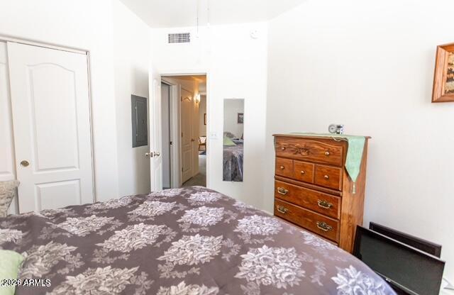 9151 West Greenway Road, Unit 239 Peoria, AZ 85381 - Photo 17 of 18 a bedroom with a bed and a dresser